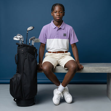 HARG junior golf polo in royal purple and chalk white, comfort fit, lightweight, moisture-wicking fabric.
