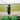 Child practicing golf swings on a driving range